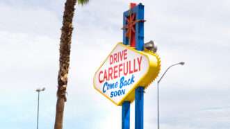 The back of the sign at the entrance to Las Vegas, Nevada, reading "Drive Carefully, Come Back Soon" | Tero Vesalainen | Dreamstime.com