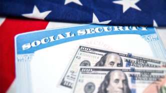 Social Security card over an American flag, with 0 bills on top | ID 343581404 © Cttpnetwork | Dreamstime.com