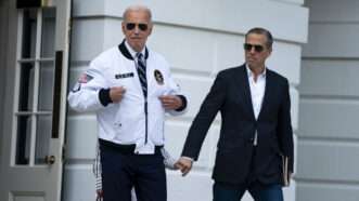 President Joe Biden, gesturing to his white Team USA jacket, leaves the White House with his son, Hunter Biden. | Bonnie Cash - via CNP/Polaris/Newscom