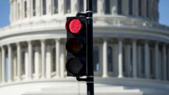 Red traffic light in front of the U.S. Capitol Building |  Bill Clark/CQ Roll Call/Newscom