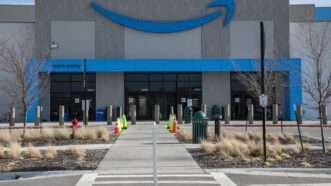 Front entrance to an Amazon fulfillment center in Kansas, with the Amazon logo atop the front doors. | Michael Siluk/UCG/Universal Images Group/Newscom