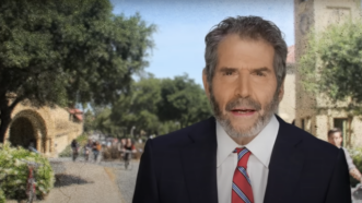 John Stossel is seen in front of a university campus | Stossel TV