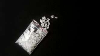 A baggy of white crystals representing the drug known as "bath salts." | Helinloik | Dreamstime.com