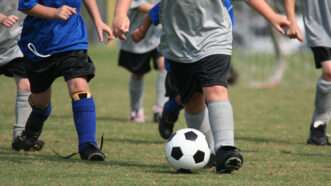 Kids playing soccer | Kids Playing © Rmarmion | Dreamstime.com