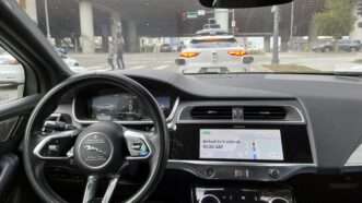 The view out the windshield of a car from the driver's seat, also showing the steering wheel and dashboard | Kyodo/Newscom