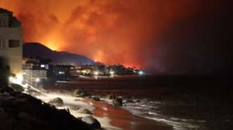 Beach homes in the Pacific Palisades area of Los Angeles, as wildfires rage just over the horizon. | Atlas Photo Archive/Cal Fire / Avalon/Newscom