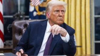 Donald Trump sits behind the Resolute Desk in the Oval Office | CNP/AdMedia/SIPA/Newscom