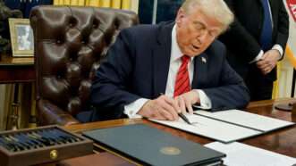 Trump signs a document in the Oval Office | CNP/AdMedia