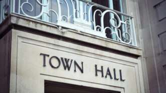 The town hall sign in stone above a local government office. | Lance Bellers | Dreamstime.com