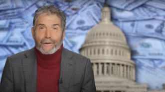 John Stossel is seen in front of the U.S. Capitol surrounded by money | Stossel TV