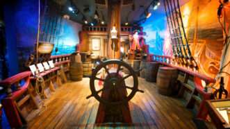 A ship's wheel on display at a museum | Pirate & Treasure Museum