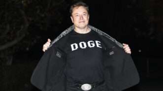 Elon Musk shows off his DOGE T-shirt at the White House | Joshua Sukoff/Medill News Service/Newscom