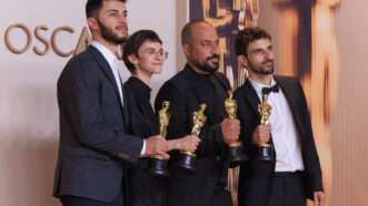 People involved with "No Other Land" pose with Oscars | Burt Harris/ZUMAPRESS/Newscom