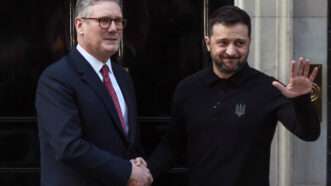 Prime Minister Keir Starmer of the United Kingdom and President Volodymyr Zelenskyy of Ukraine shake hands and wave to reporters outside 10 Downing Street, the prime minister's official residence in London. | Martyn Wheatley/i-Images / Polaris/Newscom