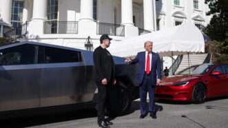 Elon Musk and President Trump in front of the White House with Tesla vehicles | amuel Corum - Pool via CNP/CNP / Polaris/Newscom