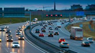 Cars drive on a highway in both directions | Ginasanders/Dreamstime.com