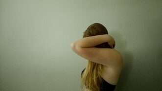 A photo of a woman in a bra obscuring her face with her arm | Photo by <a href="https://unsplash.com/@addymae?utm_content=creditCopyText&utm_medium=referral&utm_source=unsplash">Addy Mae</a> on <a href="https://unsplash.com/photos/a-woman-with-her-head-in-her-hands-leaning-against-a-wall-FNIrireBNGM?utm_content=creditCopyText&utm_medium=referral&utm_source=unsplash">Unsplash</a>       