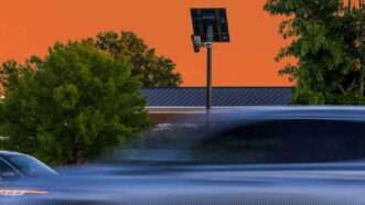 A surveillance camera overlooking a busy street. | Illustration: Eddie Marshall | Kendall Warner | TNS | Newscom | ChatGPT