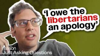 A photo of Noah Smith on the left, the Just Asking Questions logo in the lower left corner, the words "I owe libertarians an apology" in the middle in black and red | Graphic by John Osterhoudt