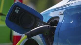 A blue electric vehicle being recharged | imageBROKER/Udo Herrmann/Newscom