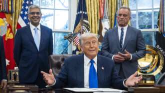 Donald Trump, Jay Bhattacharya, and Robert F. Kennedy, Jr. in the Oval Office | Jim LoScalzo - Pool via CNP/CNP / Polaris/Newscom