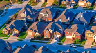 An aerial view of suburban houses | Photo: Art Wager/iStock