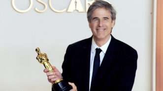 Man holding an Academy Award | Jennifer Bloc/ZUMAPRESS/Newscom