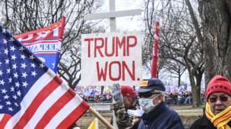 A shot from the pro-Trump rally before the January 6, 2021 Capitol Riot. In the picture, a giant white cross and a rally sign that reads "Trump won" can be seen | J.M. Giordano/ZUMAPRESS/Newscom