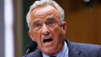 Robert F. Kennedy Jr. speaks into a microphone | Aaron Schwartz/Sipa USA/Newscom