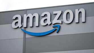Amazon logo on the outside of a fulfillment center in France. | Sebastien Salom-Gomis/SIPA/Newscom