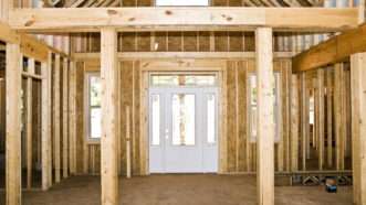 A view, from inside a home under construction, of the front door. | Susan Leggett | Dreamstime.com