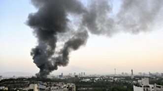 Smoke billowing over Tehran, Iran |  Kyodo/Newscom