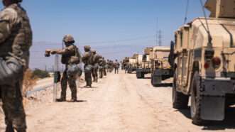 National guard soldiers building a security perimeter | U.S. Army photo by Sgt. Chase Murray