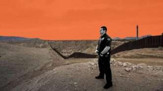 An ICE officer by the border wall with Mexico | Illustration: Eddie Marshall | Maxironwas | Dreamstime.com