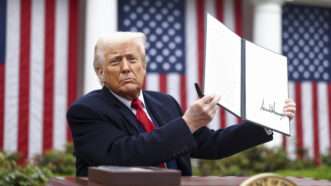 President Donald Trump holds up an executive order imposing his "Liberation Day" tariffs | CNP/AdMedia/Sipa/Newscom