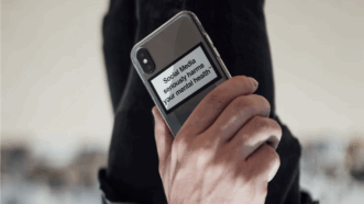 A smartphone with a warning sign that says "Social media seriously harms your mental health" | Photo by <a href="https://unsplash.com/@notso?utm_content=creditCopyText&utm_medium=referral&utm_source=unsplash">Christopher Ott</a> on <a href="https://unsplash.com/photos/person-holding-black-iphone-4-hgGLolfrGyQ?utm_content=creditCopyText&utm_medium=referral&utm_source=unsplash">Unsplash</a>       