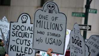 Protestor sign that reads, "One of millions who starved w/o USAID" | ID 368328248 ©  Cpenler | Dreamstime.com