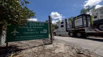 A truck drives past an entry sign for the Dade-Collier Training and Transition Airport | D.A. Varela/TNS/Newscom