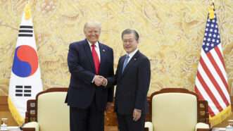 Trump shakes hands with former South Korean President Moon Jae-in | Polaris/Newscom