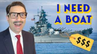 Happy Remy smiles in front of a battleship with a large price tag attached. | ReasonTV