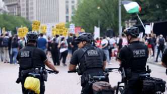 Police officers monitor a ''No War on Iran'' demonstration outside the White House in Washington, DC, on June 18, 2025. | Gent Shkullaku/ZUMAPRESS/Newscom