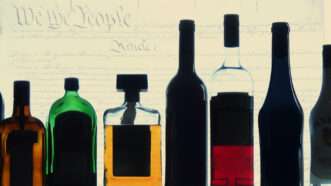 Bottles of alcohol with the U.S. Constitution in the background | Illustration: Eddie Marshall | Kun Yang | Dreamstime.com