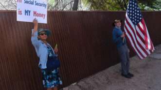 A protester holds up a sign that says "My Social Security Is My Money." | Christopher Brown/ZUMAPRESS/Newscom