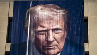 A Labor Day banner featuring President Donald Trump's face | Bonnie Cash/UPI/Newscom