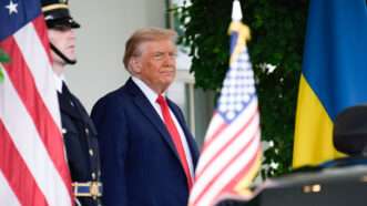President Donald Trump seems to scowl as he waits outside the White House to receive a visiting dignitary. | Sipa USA/Newscom