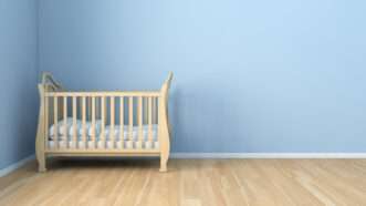Nursery with an empty crib. | DPST/Newscom