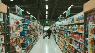 People shopping in a grocery store | Photo by Frankie Cordoba on Unsplash