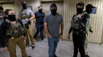 Masked ICE agents | Michael Nigro/ZUMAPRESS/Newscom