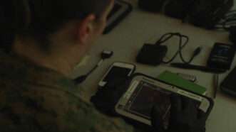 A criminal investigator with 2nd Law Enforcement Battalion (LE Bn), II Marine Expeditionary Force, Information Group extracts data from electronic devices with the Cellebrite tablet during an exercise in LZ Phoenix, N.C., May 20, 2019. | U.S. Marine Corps photo by Sgt. Luisa Torres
