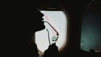 The outline of a person is seen with an airplane window in the background | Photo by <a href="https://unsplash.com/@lgnwvr?utm_source=unsplash&utm_medium=referral&utm_content=creditCopyText">LOGAN WEAVER | @LGNWVR</a> on <a href="https://unsplash.com/photos/person-in-car-looking-at-the-window-RiD-wabAD3E?utm_source=unsplash&utm_medium=referral&utm_content=creditCopyText">Unsplash</a>       